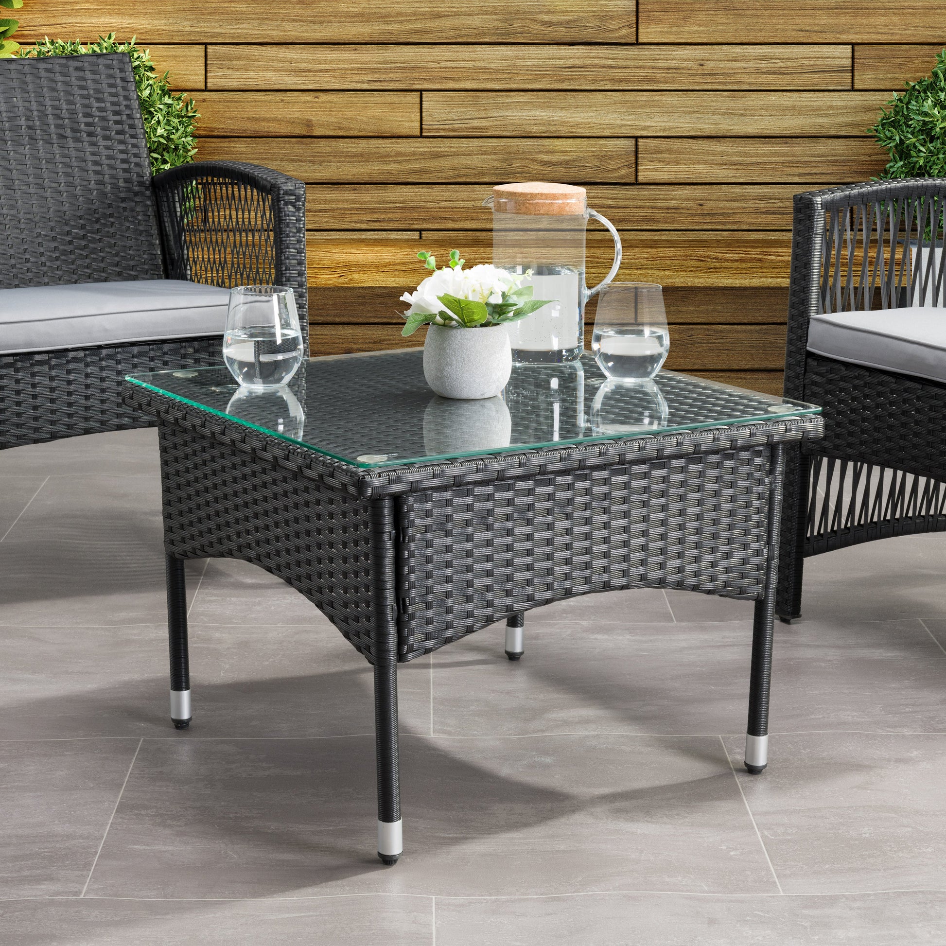 black weave Outdoor Wicker Side Table Parksville Collection lifestyle scene by CorLiving#color_textured-black-weave